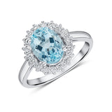 Oval Cut Aquamarine and Diamond Halo Ring in 18ct White Gold by Harrogate Jewellers, a bespoke engagement ring with lab grown diamonds, popular in Yorkshire.