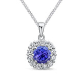 Elegant Tanzanite and Diamond Halo Pendant in White Gold by Harrogate Jewellers, showcasing a vibrant 6mm round Tanzanite surrounded by 12 sparkling diamonds, ideal for bespoke wedding jewellery.