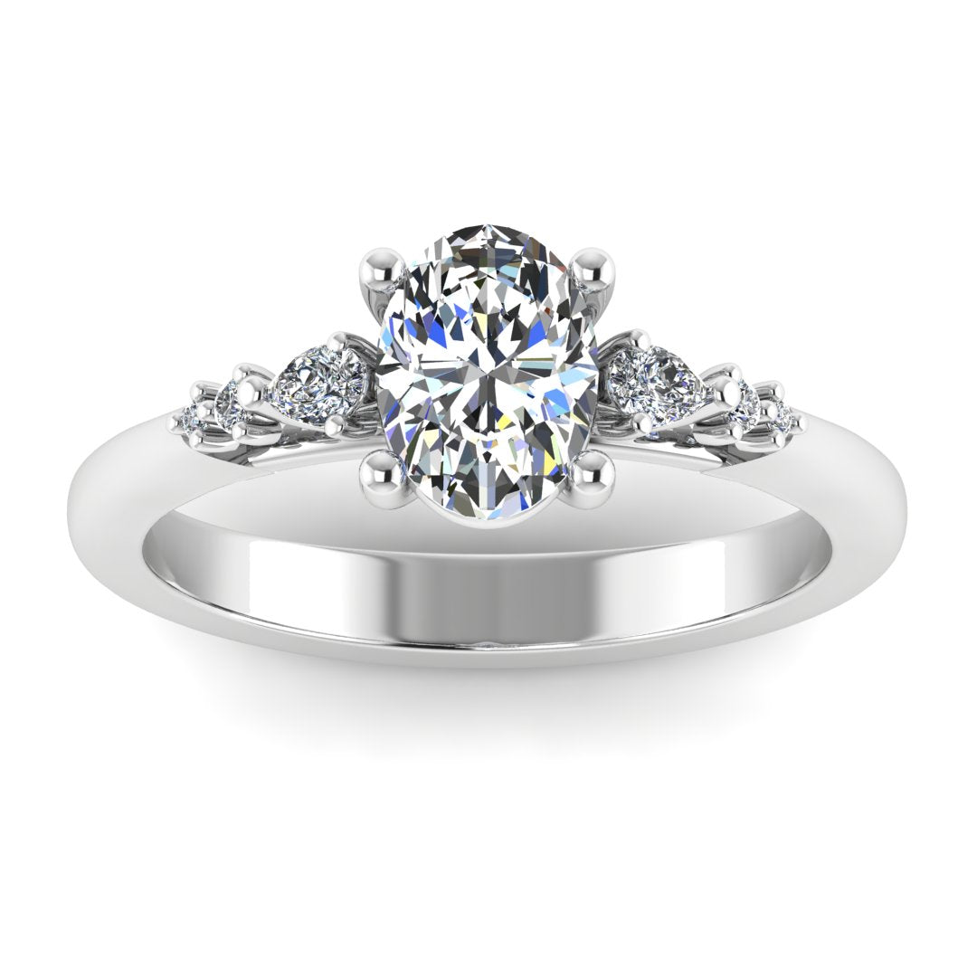 Harrogate Jewellers' ORIANNA ring featuring a lab-grown oval cut solitaire diamond surrounded by mixed cut diamond shoulders, crafted in white gold or platinum.