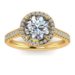 Harrogate Jewellers' DELPHINE lab-grown diamond engagement ring, featuring a classic round brilliant cut diamond in a halo setting, on a white gold band, against a white backdrop.