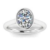 Harrogate Jewellers' lab-grown oval cut diamond ring, beautifully bezel set in platinum. A perfect choice for bespoke, eco-conscious Yorkshire engagement rings.