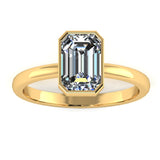 Vivienne Lab-Grown Emerald Cut Bezel Set Engagement Ring by Harrogate Jewellers, featuring a brilliant rectangular diamond on a refined platinum band, against a white background.
