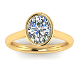 Harrogate Jewellers' ELARA lab-grown oval cut diamond engagement ring, bezel set on a platinum band, against a white backdrop.