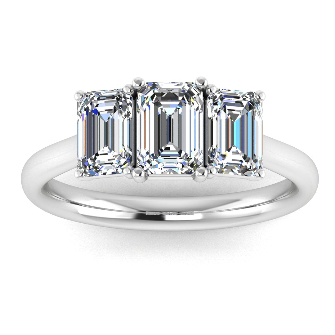 Harrogate Jewellers Lab-Grown Emerald Cut Diamond Trilogy Ring in white gold, featuring three meticulously cut diamonds, symbolizing past, present, and future. Perfect for bespoke Yorkshire engagement and wedding rings.