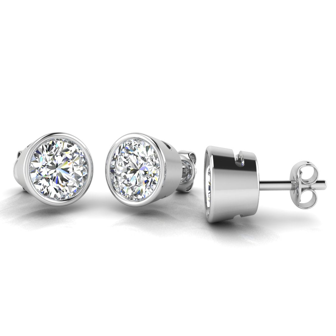 Harrogate Jewellers' Round Brilliant Cut Solitaire Diamond Rubover Earrings in white gold or platinum, showcasing 0.80ct Earth Mined Diamonds, perfect for a bespoke Yorkshire wedding.