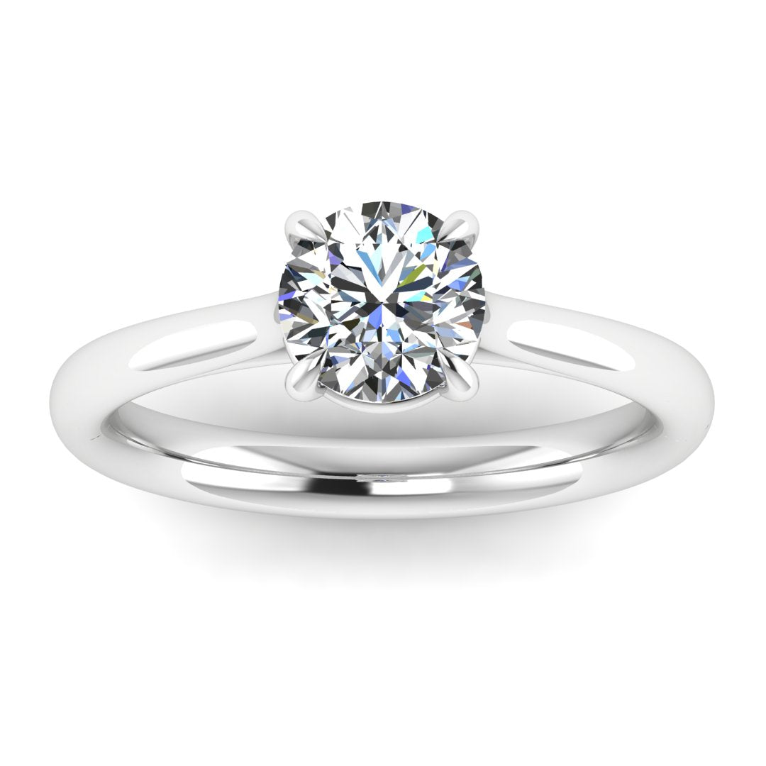 Close-up view of Harrogate Jewellers' MOLLY - Low Set Lab-Grown Diamond Solitaire Engagement Ring, a white gold ring featuring a round brilliant-cut diamond, set in a four-claw setting on a stark white background.