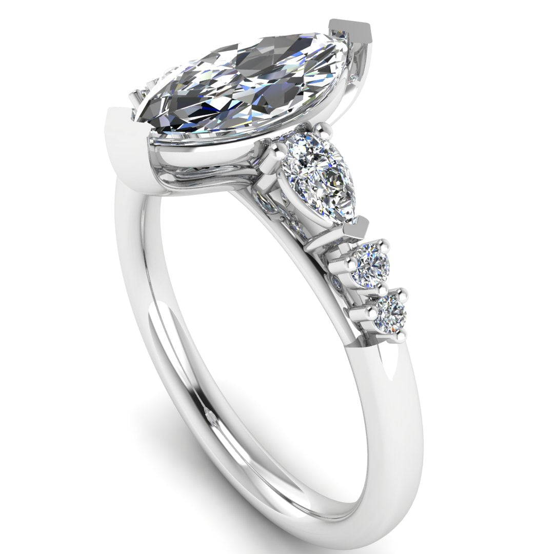 Harrogate Jewellers' lab grown marquise cut solitaire, adorned with mixed cut diamond shoulders, set in platinum, bespoke engagement ring from Yorkshire.