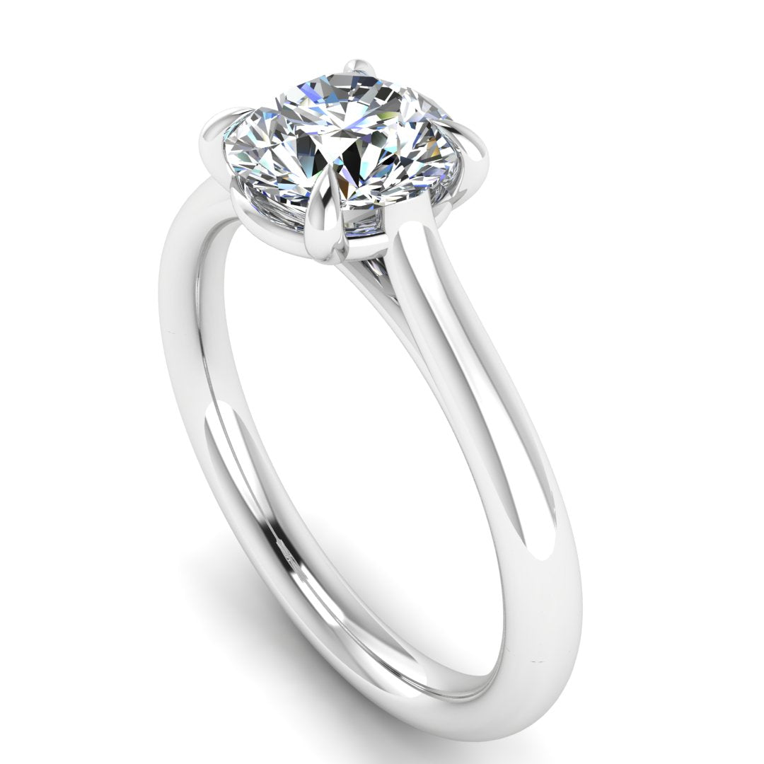 Round Brilliant Cut Solitaire Engagement Ring by Harrogate Jewellers, featuring a natural earth mined diamond in a talon claw setting, crafted from white gold.