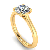 Harrogate Jewellers' round brilliant cut classic solitaire talon claw engagement ring, showcasing a natural, earth mined diamond, in a platinum setting on a white background.