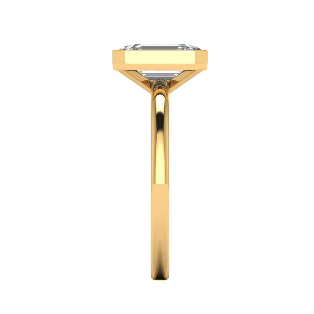Harrogate Jewellers' Vivienne Lab-Grown Emerald Cut Bezel Set Engagement Ring, showcasing a brilliant, laboratory-grown diamond on a platinum band, ideal bespoke jewellery from Yorkshire.