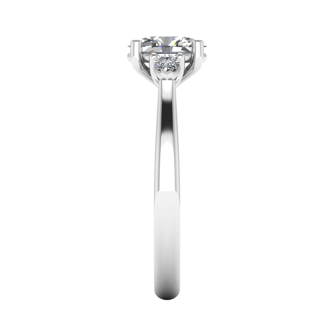 Elegant oval and pear cut diamond trilogy ring 1.22ct by Harrogate Jewellers, perfect for engagement or bespoke jewellery, made with Earth Mined Diamonds, white gold setting shown on a white background.