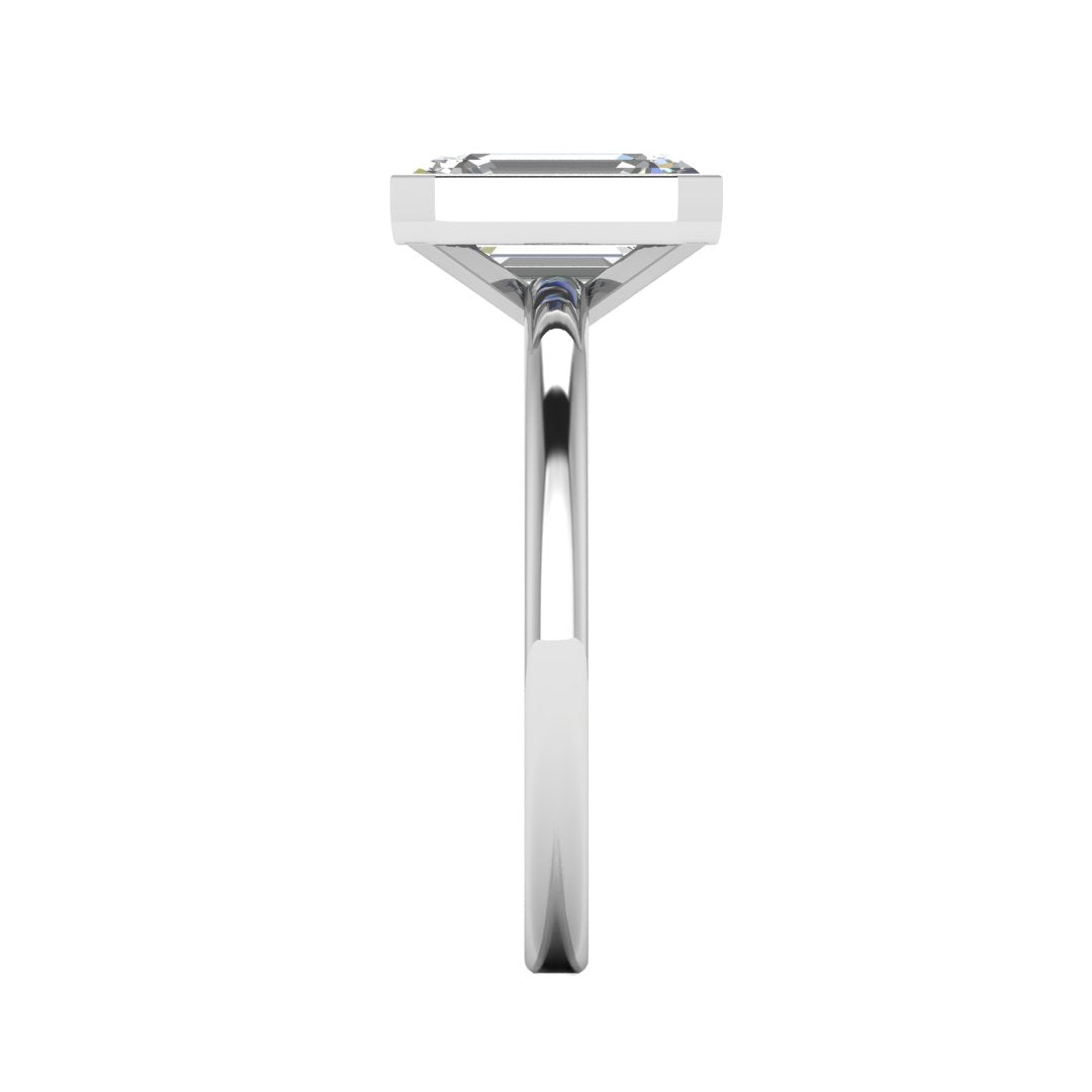 Harrogate Jewellers' Vivienne lab-grown emerald cut engagement ring, bezel set in platinum with a delicate band, perfect for bespoke Yorkshire weddings.