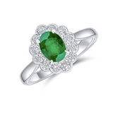 Oval cut emerald and diamond halo ring in 18ct white gold from Harrogate Jewellers, perfect for bespoke Yorkshire engagement or wedding