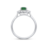 Oval Cut Emerald and Diamond Halo Ring by Harrogate Jewellers, crafted in 18ct white gold, perfect for bespoke engagement or wedding rings in Yorkshire.