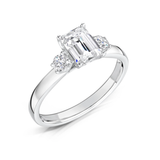 Harrogate Jewellers' Emerald and Round Brilliant Cut Diamond Trilogy Ring 0.80ct, a bespoke jewellery piece perfect for engagements or weddings in Yorkshire. Features lab grown diamonds.