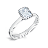 Bezel Set Emerald Cut Solitaire Diamond Engagement Ring by Harrogate Jewellers, showcasing laboratory grown and Earth Mined Diamonds on a platinum band, bespoke jewellery in Harrogate Yorkshire.