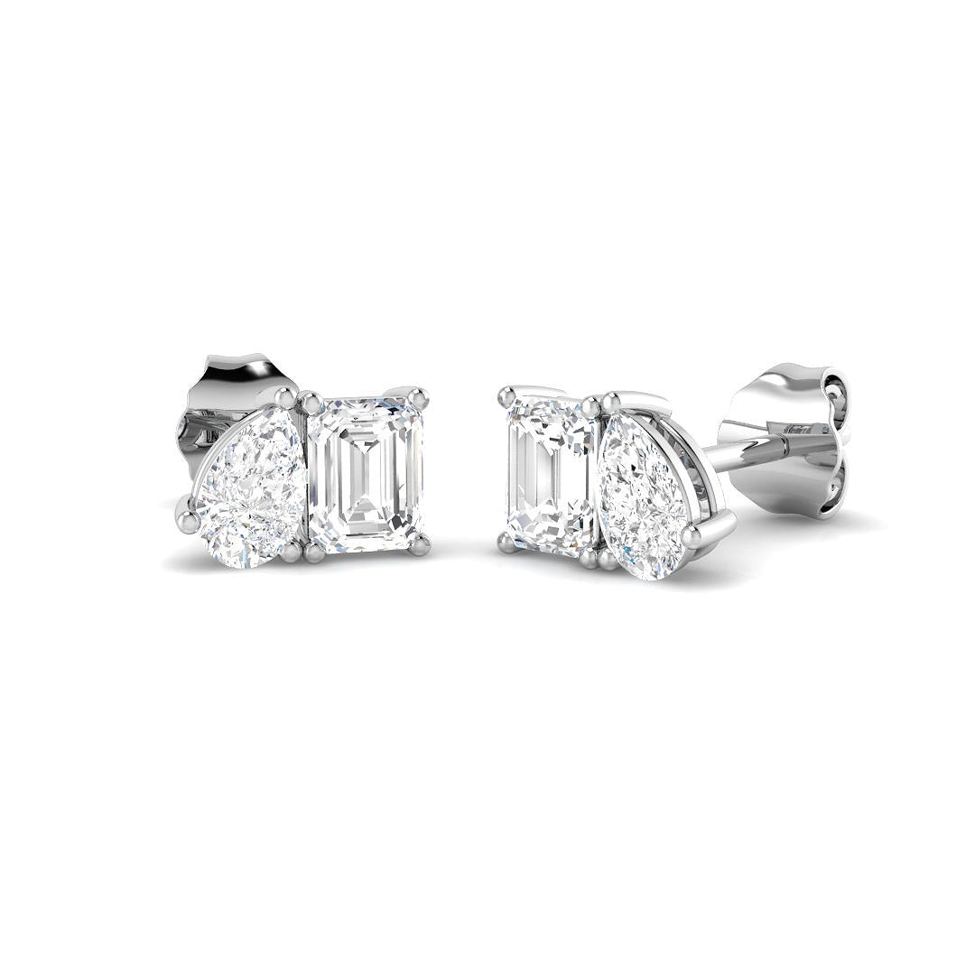 Harrogate Jewellers' Toi et Moi earrings with emerald and pear cut lab-grown diamonds in 9ct white gold on a white background