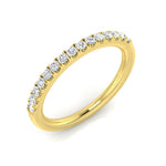 Close-up view of Harrogate Jewellers' 18ct Yellow Gold 0.20ct Diamond Half Set Eternity Ring against a white background, showcasing the band's intricate design and bright round brilliant diamonds, a perfect choice for wedding or anniversary rings in Harrogate, Yorkshire.