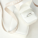 Ladies Platinum Traditional Court Wedding Ring from Harrogate Jewellers, displayed in a beige ribbon-accented box, perfect for bespoke Yorkshire weddings.