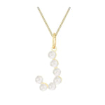 Pearl necklace with gold chain on a white background
