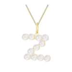 Pearl necklace with a gold chain on a white background initial letter z