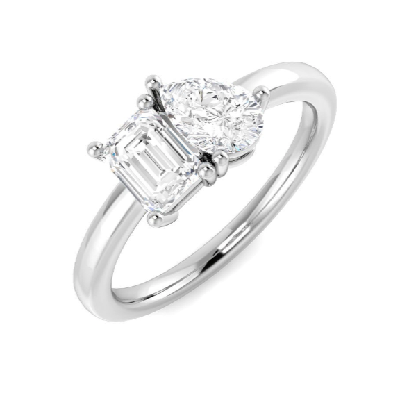 Toi et moi Diamond ring with two smaller diamonds on a white background pear and emerald cut