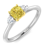Harrogate Jewellers platinum engagement ring featuring a vibrant yellow diamond flanked by smaller clear diamonds, perfect for bespoke jewellery lovers in Yorkshire