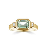 Harrogate Jewellers' bezel set ring featuring a green amethyst, accented by diamonds, crafted in white gold, perfect for bespoke Yorkshire wedding or engagement jewellery.