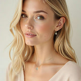 Harrogate Jewellers green amethyst and diamond bezel set drop pendant in gold, showcasing brilliant Earth mined diamonds with beautiful green amethyst. Ideal bespoke jewellery for weddings in Yorkshire.