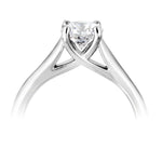 Harrogate Jewellers' Classic Cross-Over Solitaire Round Brilliant Cut Diamond Engagement Ring, crafted in platinum, showcasing an Earth Mined Diamond on a white gold band, bespoke jewellery from Yorkshire.