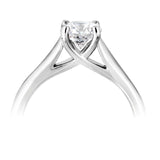 Harrogate Jewellers' Classic Cross-Over Solitaire Round Brilliant Cut Diamond Engagement Ring, crafted in platinum, showcasing an Earth Mined Diamond on a white gold band, bespoke jewellery from Yorkshire.