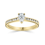 Pear Cut Diamond Engagement Ring by Harrogate Jewellers, featuring Channel Set Shoulders and earth mined diamonds, set in white gold. Bespoke jewellery from Yorkshire