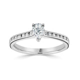 Pear Cut Diamond Engagement Ring with Channel Set Shoulders by Harrogate Jewellers, featuring a central laboratory grown diamond, complemented by round brilliant side stones set in platinum, perfect for bespoke wedding rings in Yorkshire.