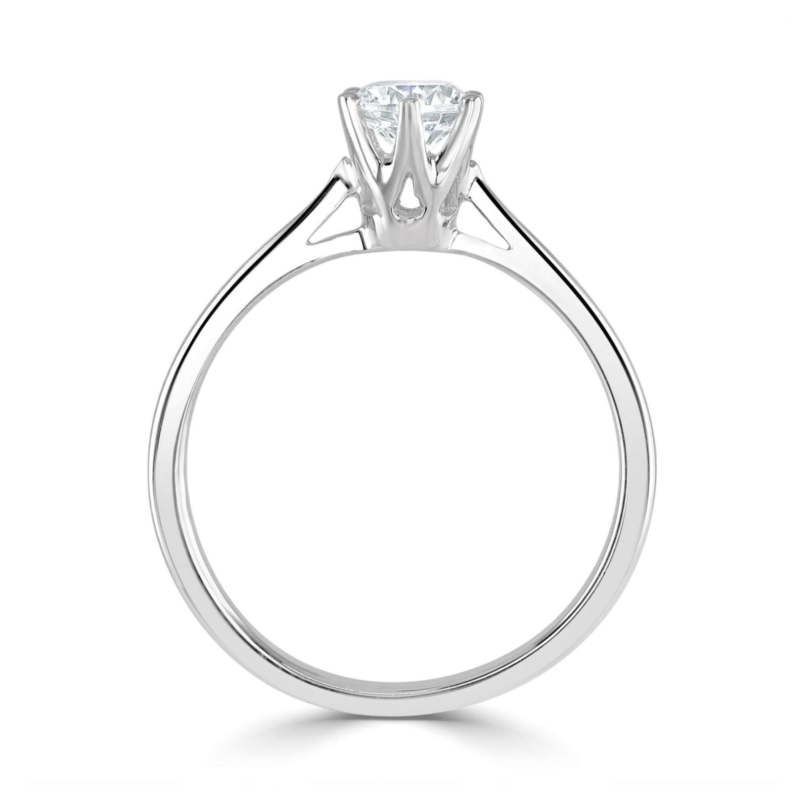 Harrogate Jewellers' six-claw classic solitaire engagement ring featuring a brilliant round cut earth-mined diamond, set in white gold, with a detailed view of its intricate design on a clean white background.