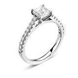 Harrogate Jewellers' Tapered Claw Set Princess Cut Diamond Engagement Ring in platinum, with a large, square-cut diamond and smaller diamonds on white gold band.