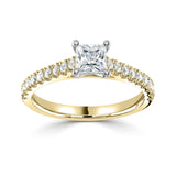 Harrogate Jewellers' Tapered Claw Set Princess Cut Diamond Engagement Ring, featuring a hand-selected, GIA-certified earth mined diamond, surrounded by smaller diamonds on a gold band.