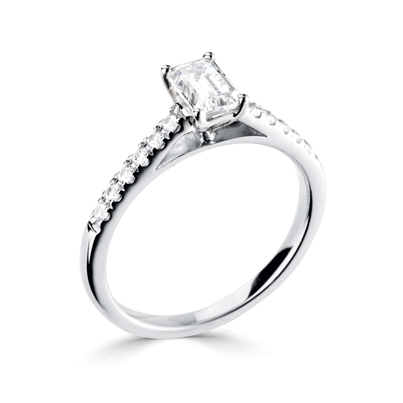Harrogate Jewellers Tapered Claw Set Emerald Cut Diamond Engagement Ring, featuring a brilliant hand-selected earth mined diamond, set on a delicate platinum band with diamond-set shoulders, ideal for bespoke Yorkshire weddings.