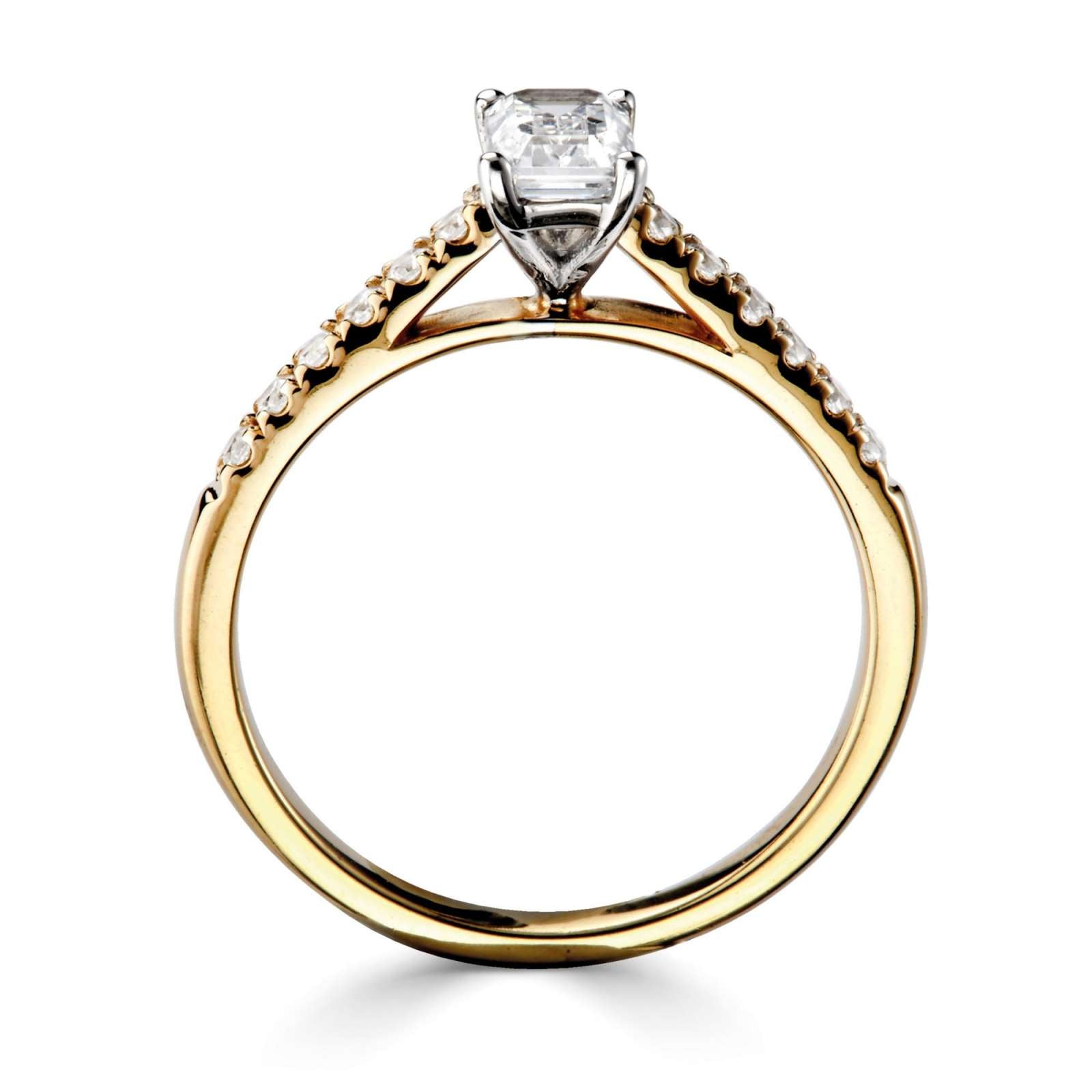Tapered claw set emerald cut diamond engagement ring, crafted by Harrogate Jewellers. The design features a central earth mined diamond encircled by smaller diamonds, set in white gold. Bespoke jewellery from Yorkshire.