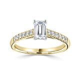 Tapered Claw Set Emerald Cut Diamond Engagement Ring by Harrogate Jewellers, showcasing a central diamond with surrounding smaller diamonds, white gold band