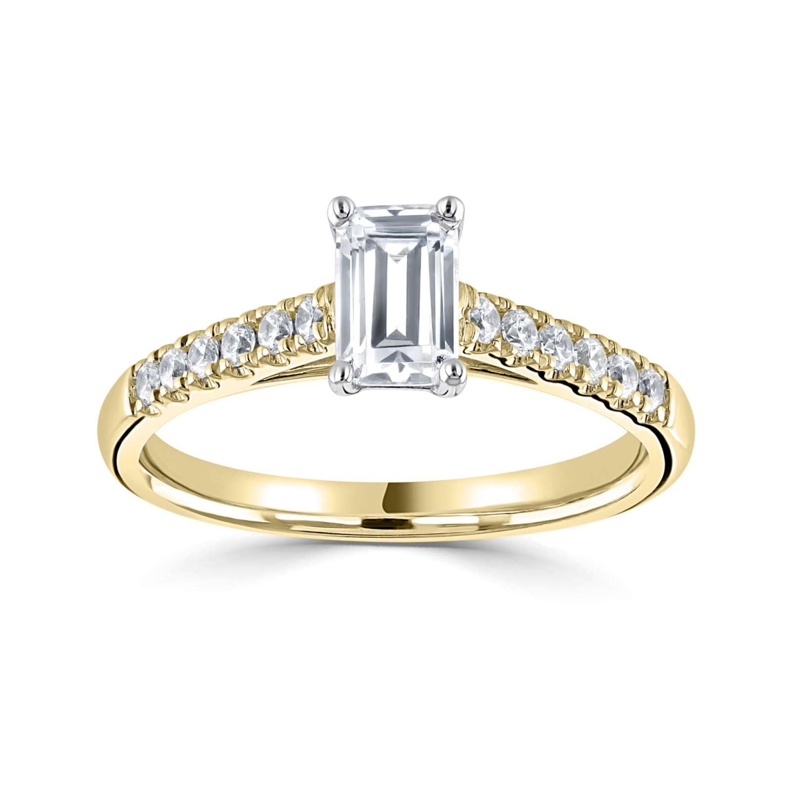 Tapered Claw Set Emerald Cut Diamond Engagement Ring by Harrogate Jewellers, showcasing a central diamond with surrounding smaller diamonds, white gold band