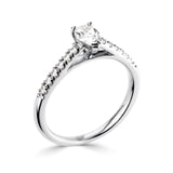 Harrogate Jewellers Tapered Claw Set Pear Cut Diamond Engagement Ring, made of platinum, featuring a central diamond and surrounding earth mined diamonds, ideal for bespoke Yorkshire wedding jewellery.