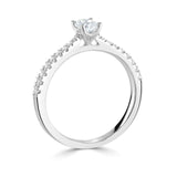 Harrogate Jewellers oval cut diamond engagement ring with tapered diamond shoulders, 0.75ct earth mined diamond, set in platinum on a white background.