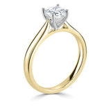 Classic Cushion Cut Solitaire Diamond Engagement Ring by Harrogate Jewellers, bespoke gold ring featuring a large, clear diamond in the center with a halo of smaller diamonds.