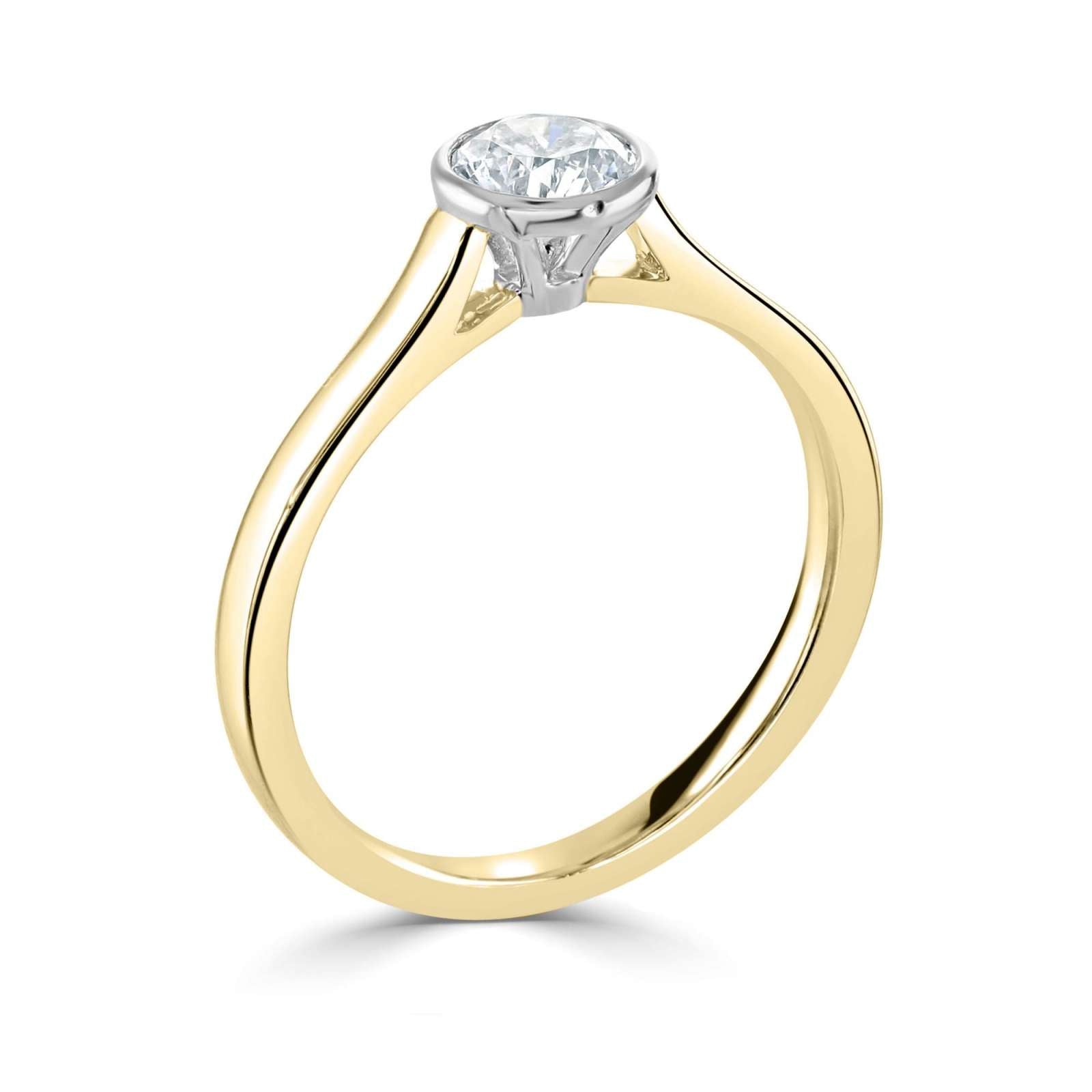 Bezel Set Round Brilliant Cut Solitaire Diamond Engagement Ring by Harrogate Jewellers, featuring a sparkling Earth Mined diamond on a platinum band.