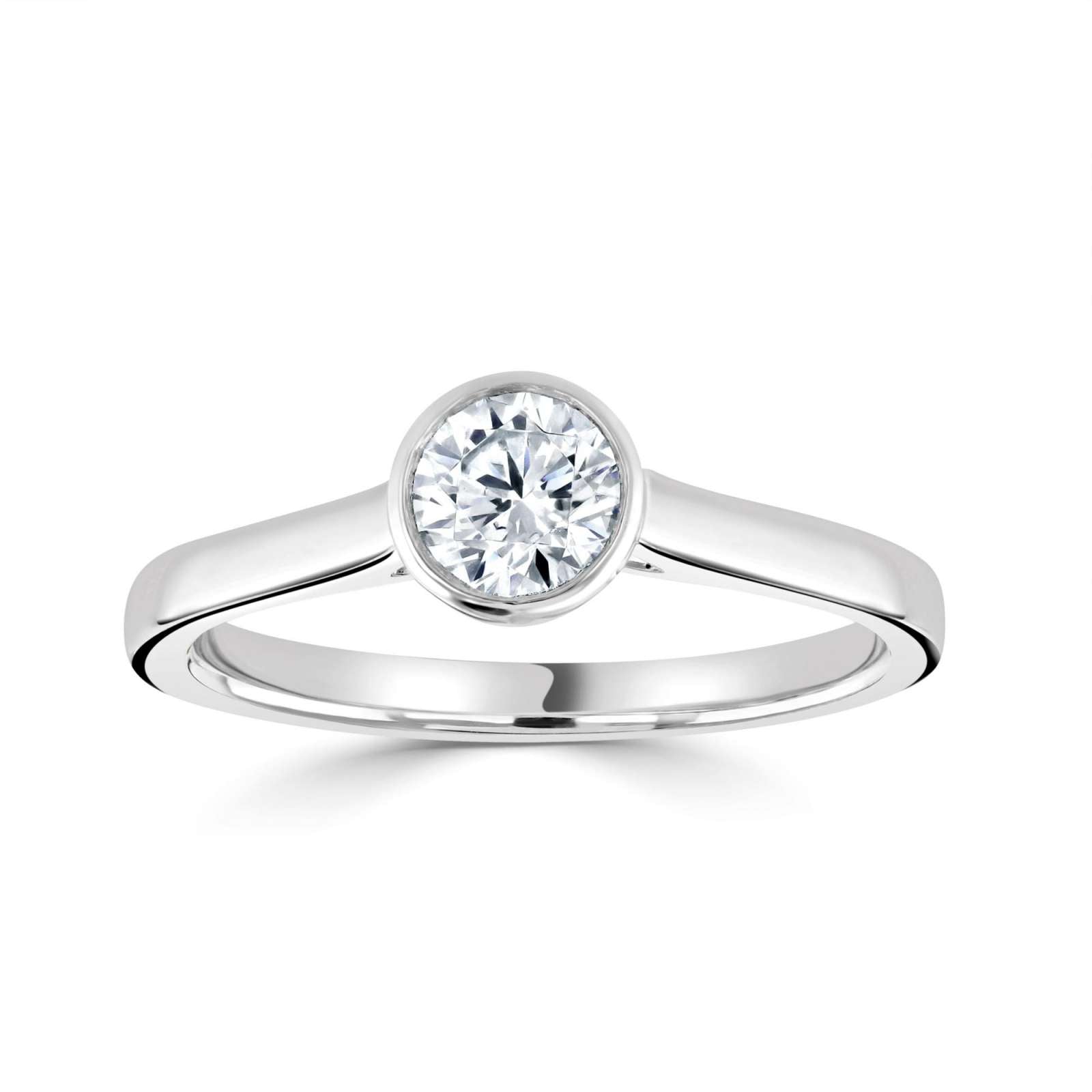 Harrogate Jewellers' Bezel Set Round Brilliant Cut Solitaire Diamond Engagement Ring, featuring a sparkling Earth Mined Diamond on a sleek platinum band, epitomizing bespoke Yorkshire jewellery.