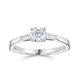 Harrogate Jewellers' Diamond Trilogy Ring, featuring a 0.50ct Round Brilliant Cut, flanked by Tapered Baguette Cut Diamonds, set in white gold, perfect for bespoke Yorkshire engagement.