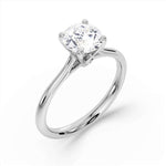 Signature Hidden Diamond Solitaire Engagement Ring by Harrogate Jewellers, featuring a brilliant-cut diamond in a platinum band, ideal for bespoke Yorkshire wedding jewellery