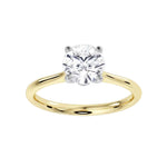 Signature Hidden Diamond Solitaire Engagement Ring by Harrogate Jewellers, featuring a round brilliant cut diamond in a four claw setting and a secret diamond detail. Earth Mined Diamond Wedding Ring in Yorkshire.