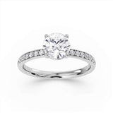 Round Brilliant Cut Diamond Engagement Ring with Grain Set Shoulders by Harrogate Jewellers, featuring a central earth-mined diamond, side-stones and platinum band.