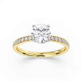 Round Brilliant Cut Diamond Engagement Ring with Grain Set Shoulders by Harrogate Jewellers, featuring Earth Mined Diamonds and crafted in platinum, displayed on a white background.